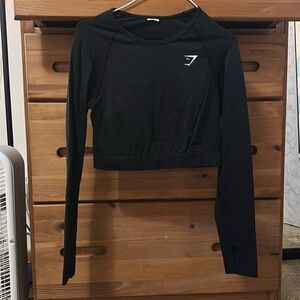 Black gymshark crop top long sleeve. Size L. Can fit M as well